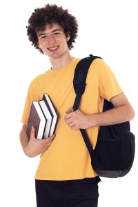 Smiling male high school student with study books