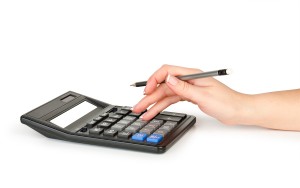 student with calculator and pen