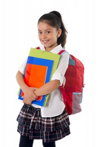 School girl in private school uniform and backpack