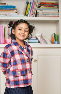 Little girl in private school uniform